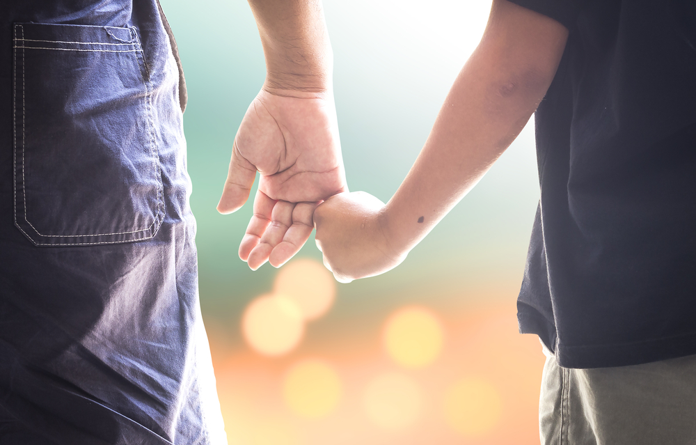 Family,day,concept:,autism,child,hand,holding,parent,finger,on