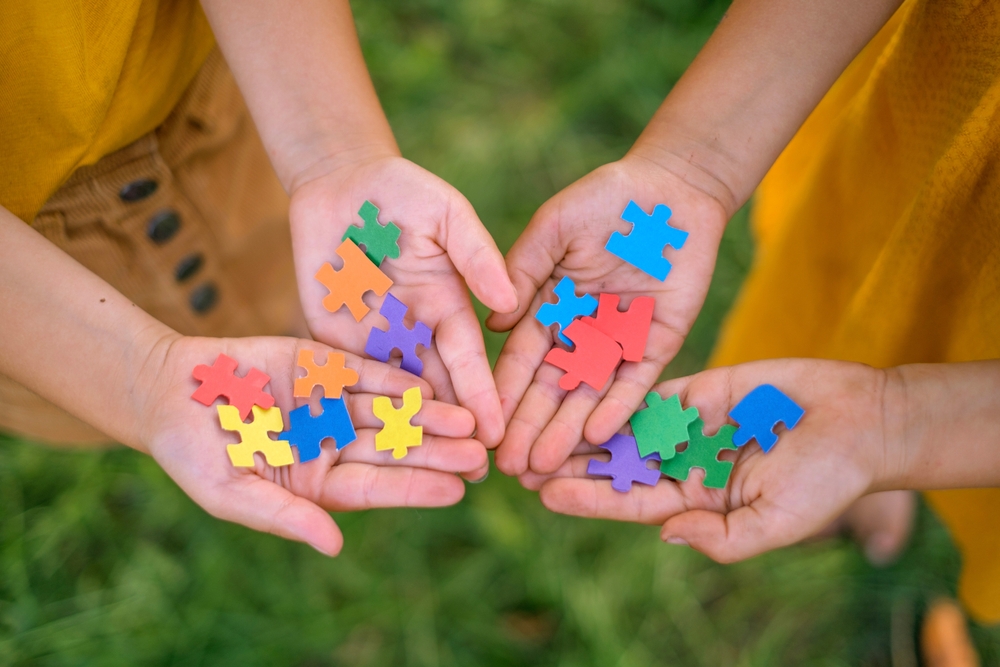 Close Up,of,pieces,of,multicolored,puzzles,in,the,hands,of